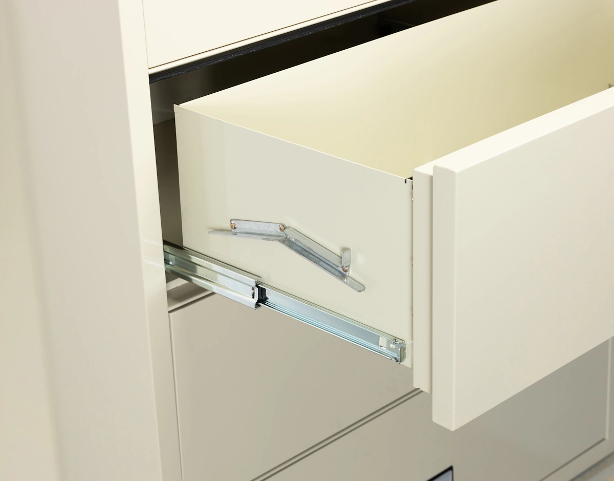 Anti-tip interlock mechanism inside a Phoenix lateral fireproof file cabinet