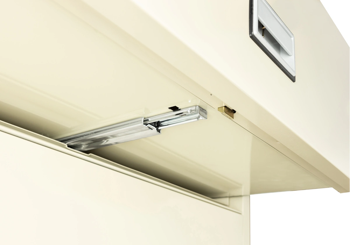 Underside of a Phoenix lateral file drawer showing three-way suspension hardware