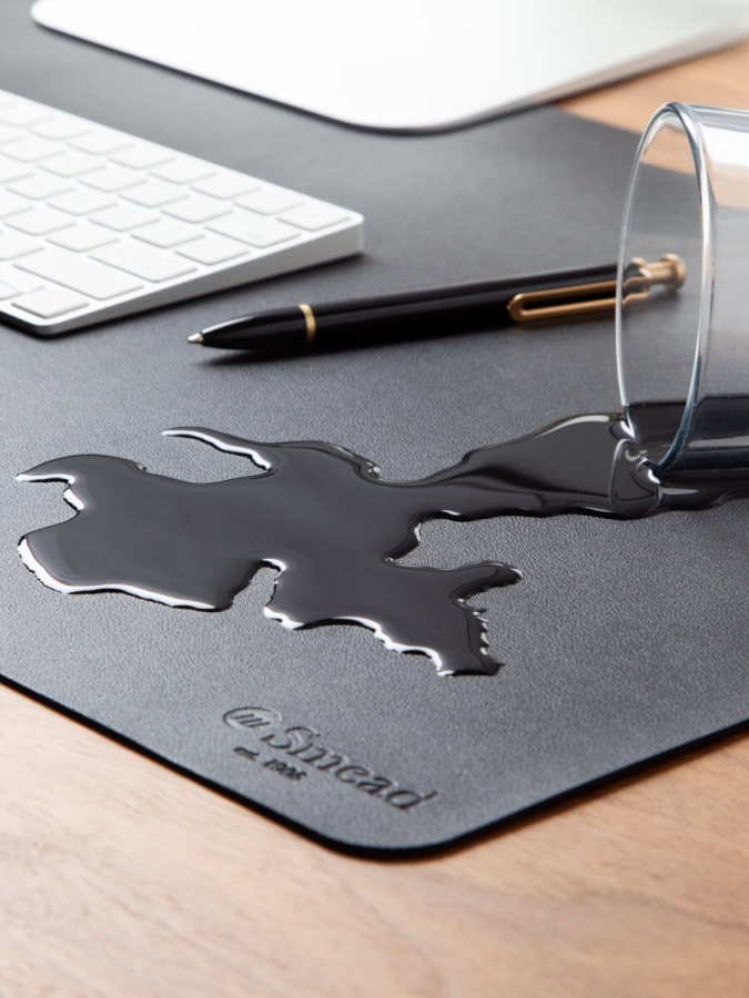 Smead Desk Pad with spill-proof protection in charcoal gray.